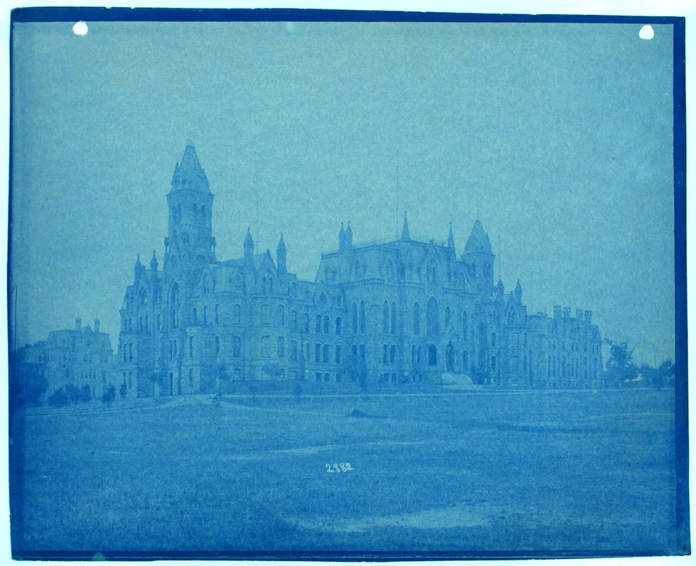 A looming Victorian mansion under a stormy sky